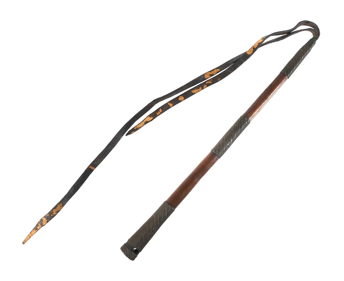 ZULU HAND WHIP QUIRT: C. 1860-70. 21" wood haft with fine wire work. Medial band grip and separate butt cap woven over the edge. The base segments made separately to accommodate a hole pierced for a wrist thong. This item 