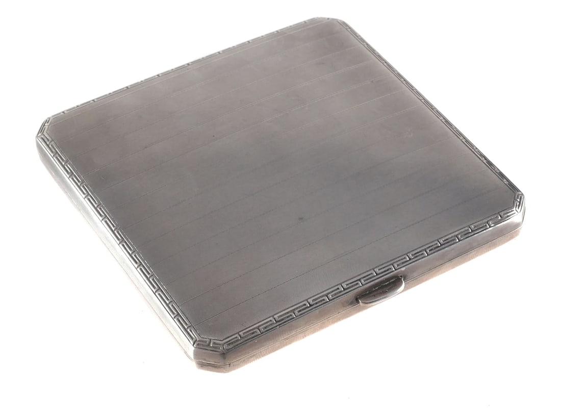 800 Silver Cigarette Case Wilhelm Binder: German Art Deco 800 silver cigarette case with gold vermeil wash interior inscribed with the initials E.S. Antique, early 1900's early 20th C. 101 g, approx. 3-1/4" square. This item can be shipped in