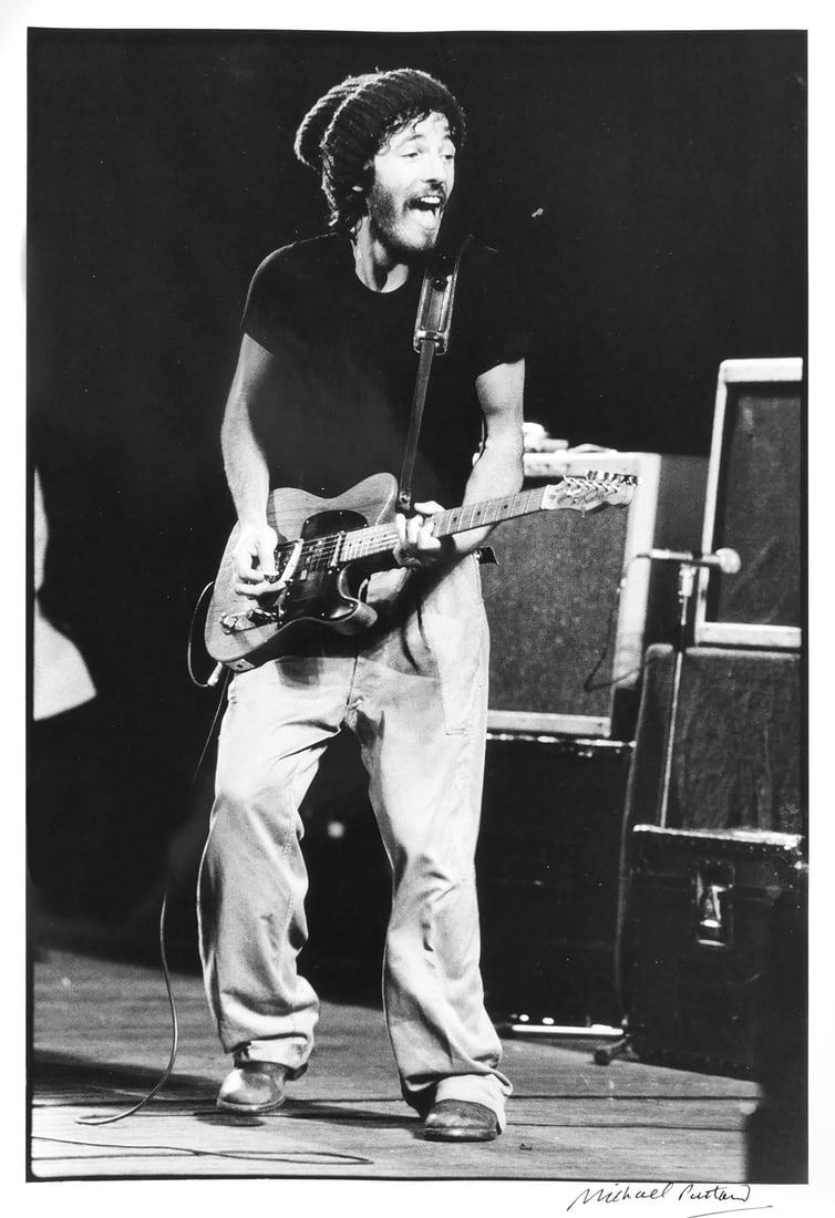 BRUCE SPRINGSTEEN, Michael Putland Photograph: Vintage photograph of Bruce Springsteen by photographer Michael Putland, signed lower right, image measures 18" x 12" paper measures 20" x 16". This item can be shipped in-house. Artwork, photographs,