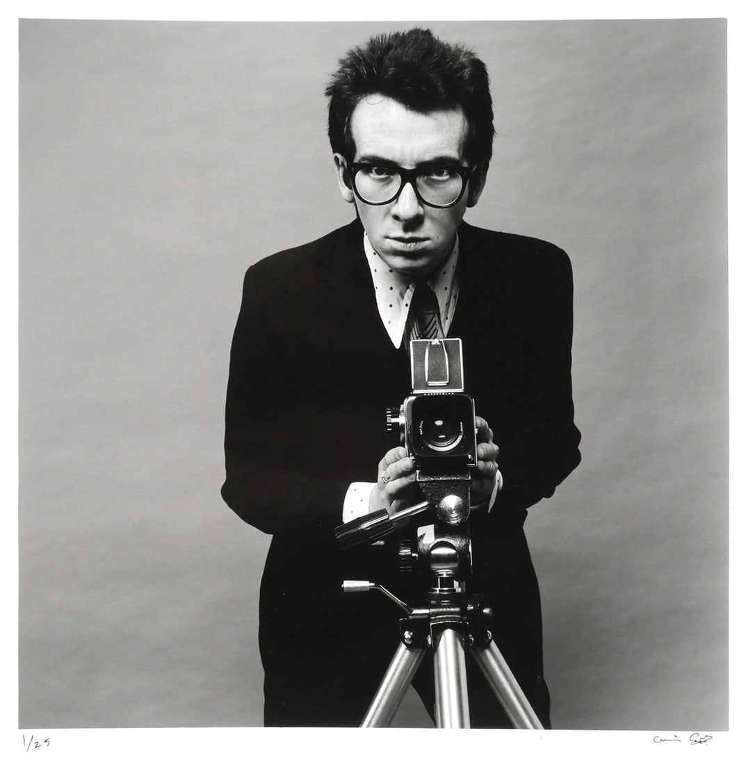 ELVIS COSTELLO, Chris Gabrin Photograph: Vintage photograph of Elvis Costello by photographer Chris Gabrin, 1978, for the album "This Year's Model", image is signed lower right and numbered 1/25 lower left. Image measures 14-1/2" x 14-1/2" p