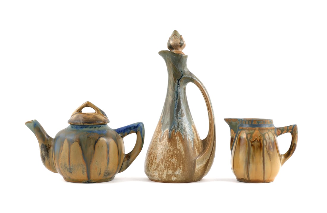 Metenier & Denbac French Art Pottery 3 Pcs: A group of three early 20th century French faience art pottery pieces. One small two cup teapot by Gilbert Metenier, having running glaze incorporating Gannat Blue, along with a similar small cream pi