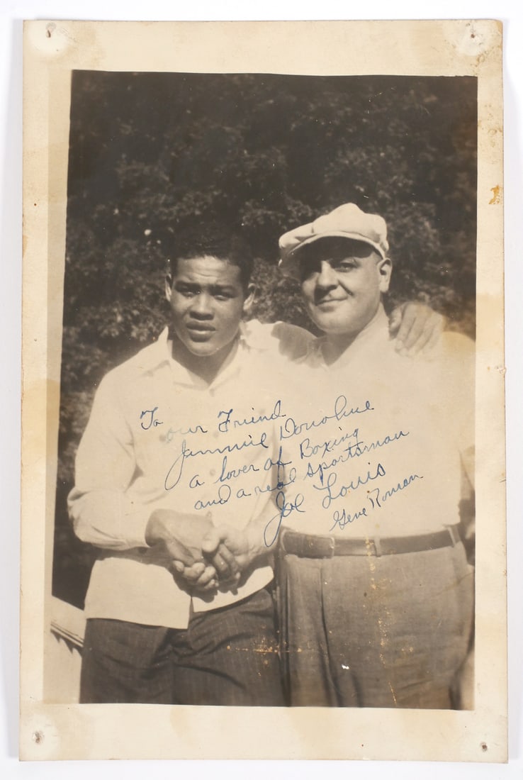 JOE LOUIS Signed Photograph w NJ Boxing Ref: 5x7 photo of Joe Louis and Gene Roman (New Jersey state boxing referee), inscribed and signed by Joe Louis, and signed by Gene Roman. Provenance: From the estate of Jimmy Donohue, owner of Donohue's R