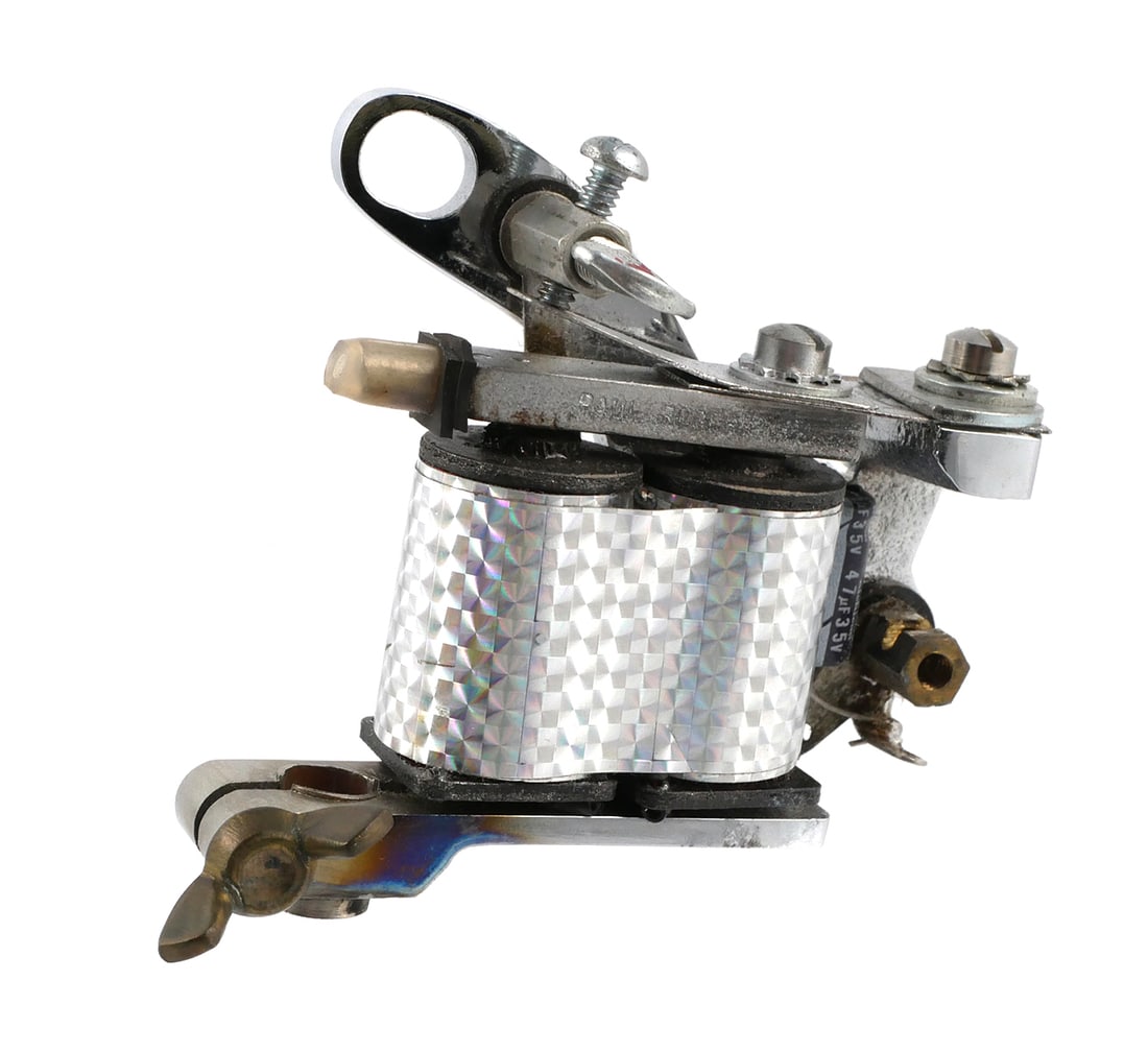 PAUL ROGERS Tattoo Iron Machine, Handmade: Rare tattoo machine, hand made by famed tattoo artist and toolmaker, Franklin Paul Rogers (American, 1950-1990). Signed "By P. Rogers" and "Mad Bee," and dated 10-85. One of three Rogers machines in t