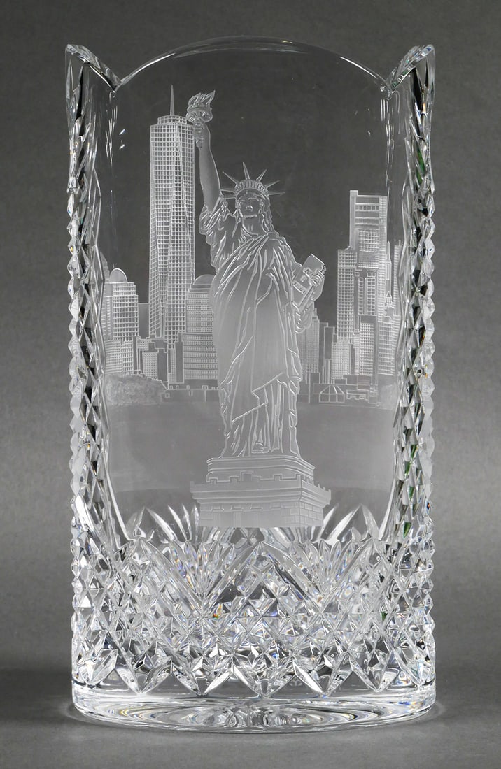 Waterford Statue of Liberty NY Skyline Vase: Waterford etched crystal vase with the Statue of Liberty and the New York City skyline with the Freedom Tower One World Trade Center. Approx. 6-1/2"L x 12"H. This item can be shipped in-house.