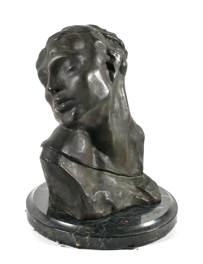 AUGUSTE RODIN, Bronze Bust "Head of Lust": Later 20th century casting of Tete de la Luxure (Head of Lust) after Auguste Rodin (French, 1840-1917). Sculpture has a beautiful patina. Stamped 7/50 and signed. Measures about 15" high on marble sta