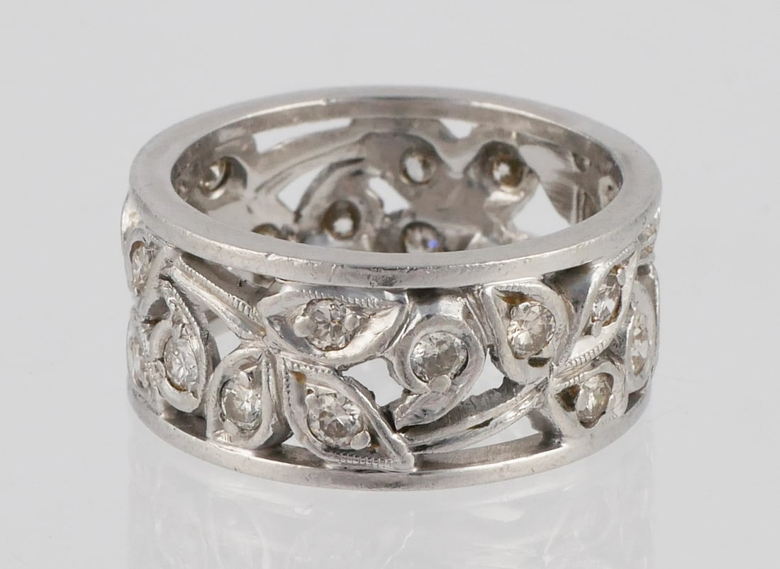 Art Deco Platinum & Diamond Eternity Ring: Size 6-1/2, 9mm wide. Weighs 10.6 grams. 22 diamonds set in openwork, about 1/2 ctw. This item can be shipped in-house.