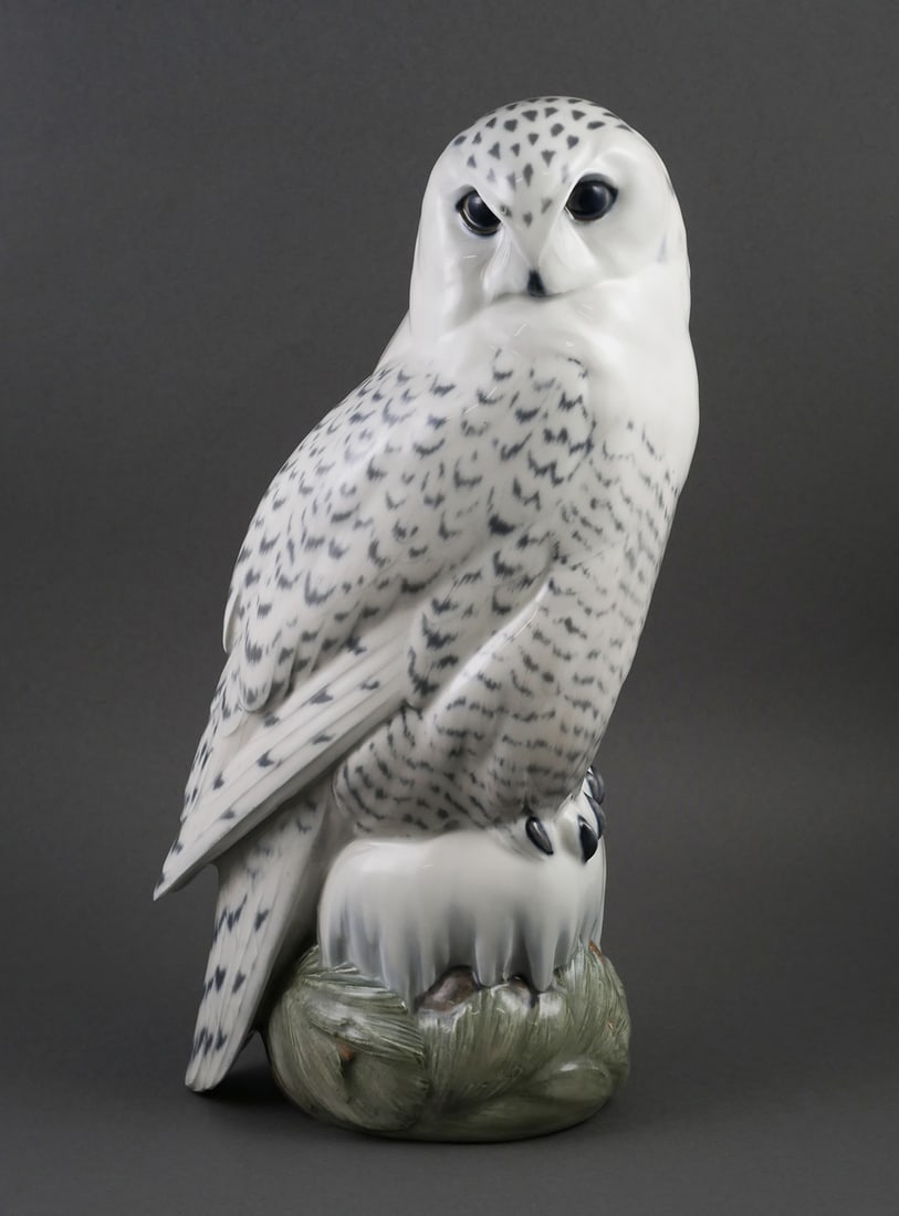 ROYAL COPENHAGEN Snowy Owl Statue: Large Royal Copenhagen Snow Owl porcelain figurine. Hand decorated in a natural palette of white, grays, blues, and greens. Designed by artist Peter Herold. Signed on bottom edge "Herold". Base is mar