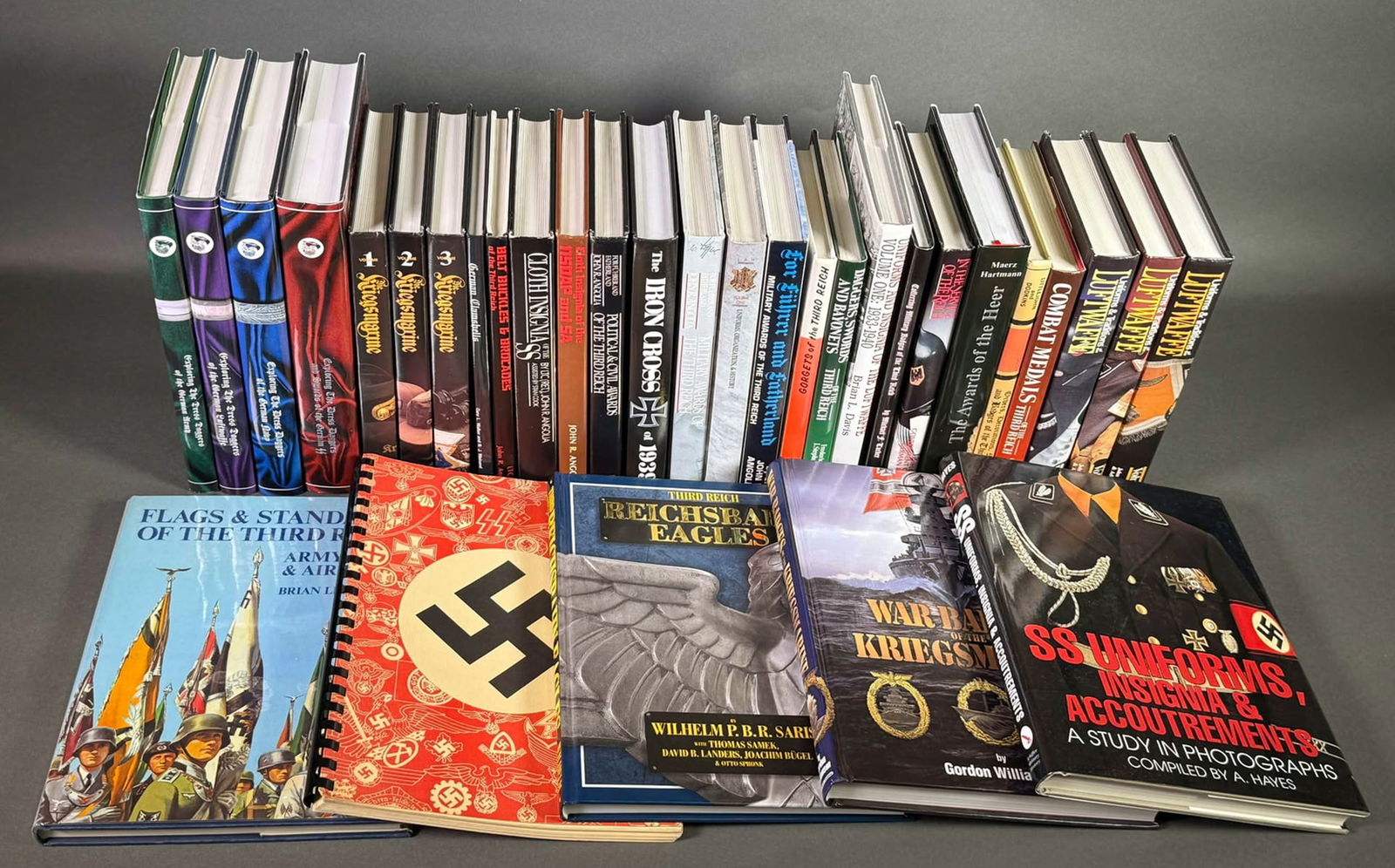 Library of WW2 German Military Items (32): Important 32-book collection of hard-to-find books on WWII German militaria (some quite scarce, with limited printings), including uniforms, daggers, insignia, awards, gorgets, medals, etc. Some title