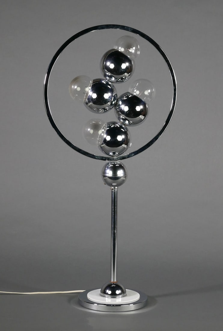 ROBERT SONNEMAN Chrome MCM Lamp: Midcentury Modern four-light chrome lamp, unsigned. Attributed to Robert Sonnemann. Measures 32" high. One of several from a private collection of Sonnemann lamps in today's auction. This item will ne