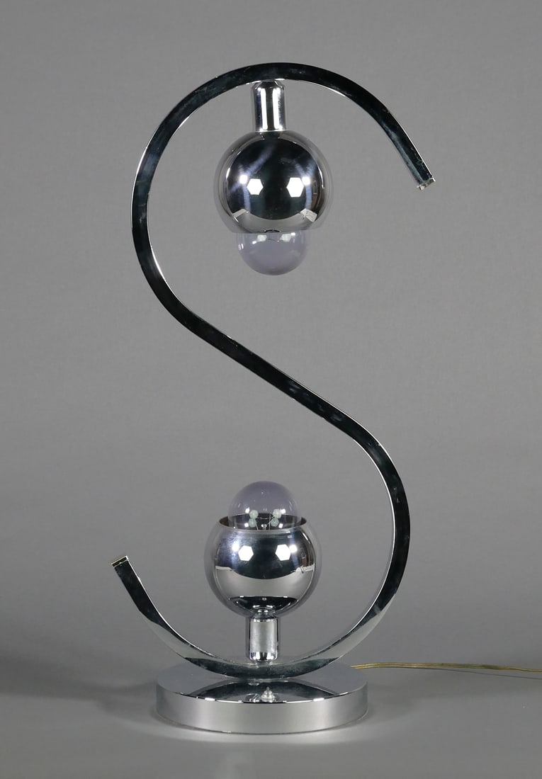 ROBERT SONNEMAN Chrome MCM Lamp: Midcentury Modern two-light chrome lamp, unsigned. Attributed to Robert Sonnemann. Measures 27-1/2" high. One of several from a private collection of Sonnemann lamps in today's auction. This item will