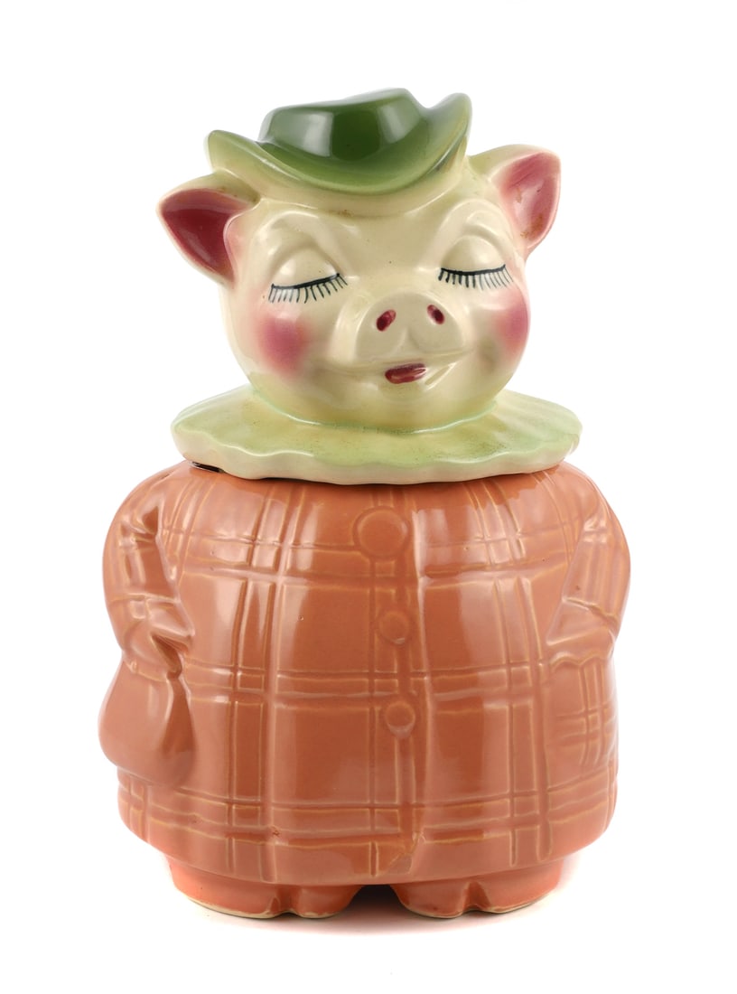 Vintage SHAWNEE Winnie Bank Cookie Jar: Shawnee Pottery Winnie the Pig cookie jar with bank head. Jar measures about 10-1/2" tall x 6-3/4" wide. Bottom is marked "Patented, Winnie, Shawnee, USA, 61". This item can be shipped in-house.