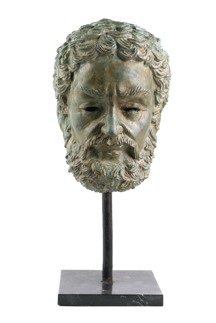 Patinated Bronze Head of Zeus or Greek Philosopher: Possibly a Greek deity or philosopher (such as Plato). Bronze head on metal mount on marble stand. Life size, measuring about 16" high overall. This item will need to be shipped by a packing company o