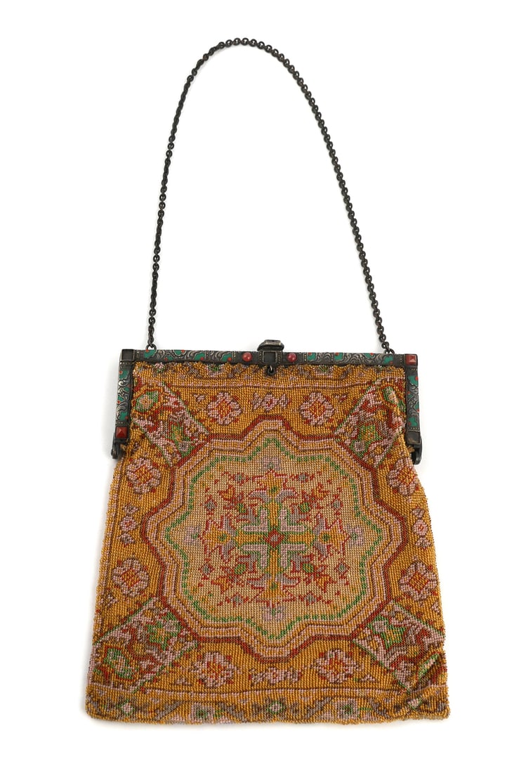 German Art Deco Beaded Purse Enamel Jeweled: Early 20th century Art Deco era micro beaded purse. Decorated in a tapestry or carpet style design with flowers. Frame with green and red enamel, marcasite, and carnelian colored glass gemstones. Inte