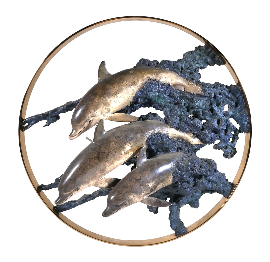 ROBERT WYLAND Bronze Dolphins Sculpture: Patinated bronze wall sculpture of leaping dolphins, about 6" deep and 23" diameter. Titled "Circle of Life," and signed by artist Wyland (American, b. 1956), numbered 87/300. Comes with original Wyla