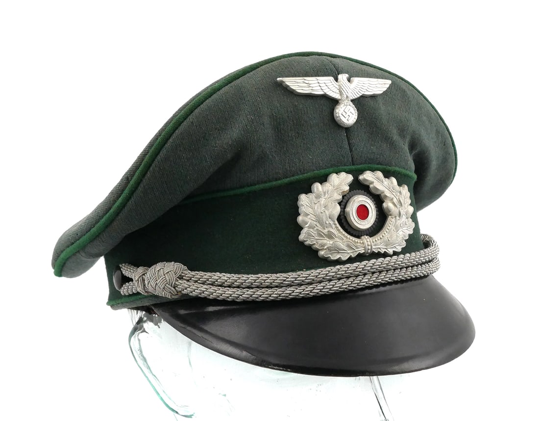 WW2: German Army Officer's Visor Cap: Authentic period LLD labeled WWII German Army officer's cap with badge and insignia. Wool. This item can be shipped in-house.