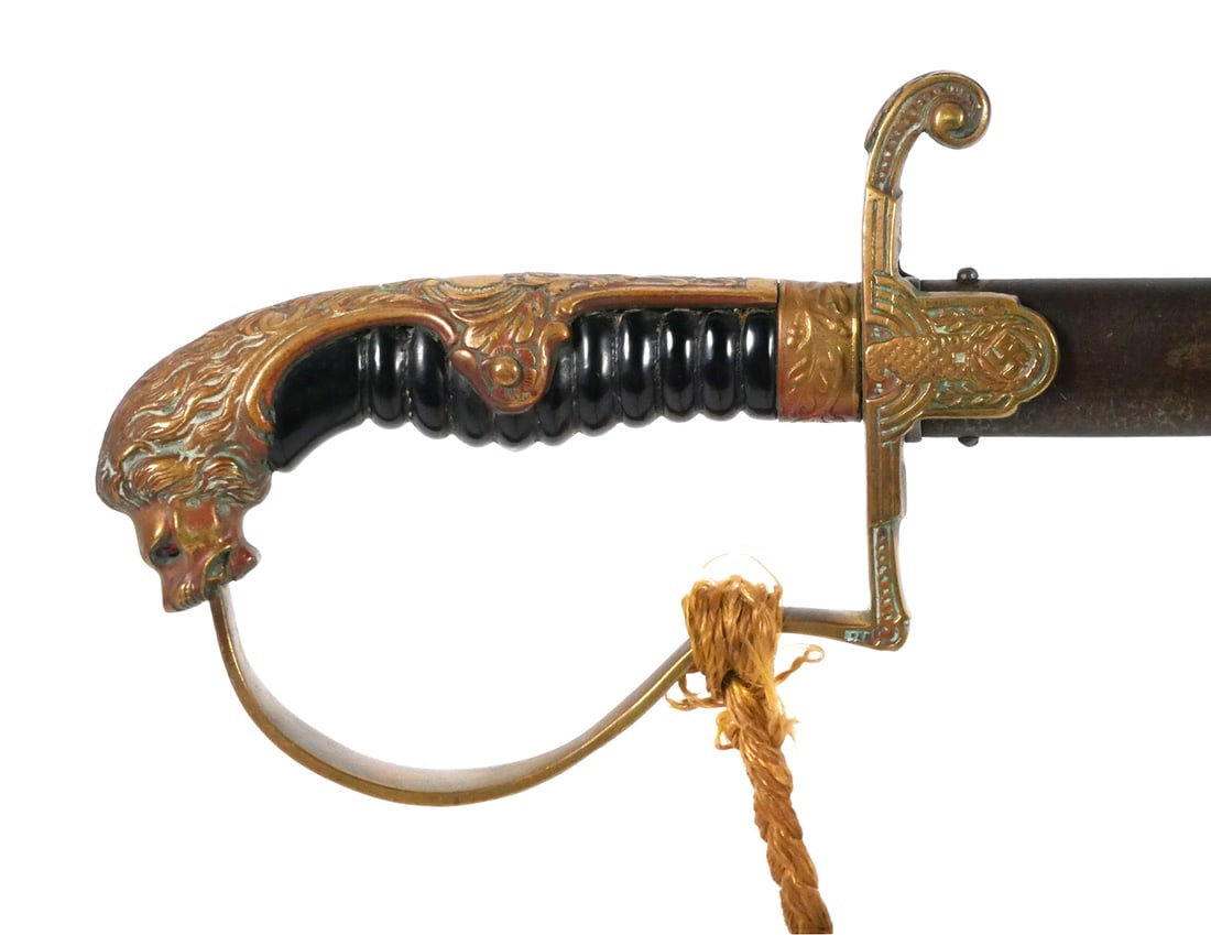 WW2: German Lion-Head Officer Sword, DRP: WWII German Lion Head sword. Blade measures approximately 32-1/2", 37-3/4" overall, with a width of 3/4". Cast brass hilt features a sculpted lion-head pommel with red glass eyes and raised oak leaf d