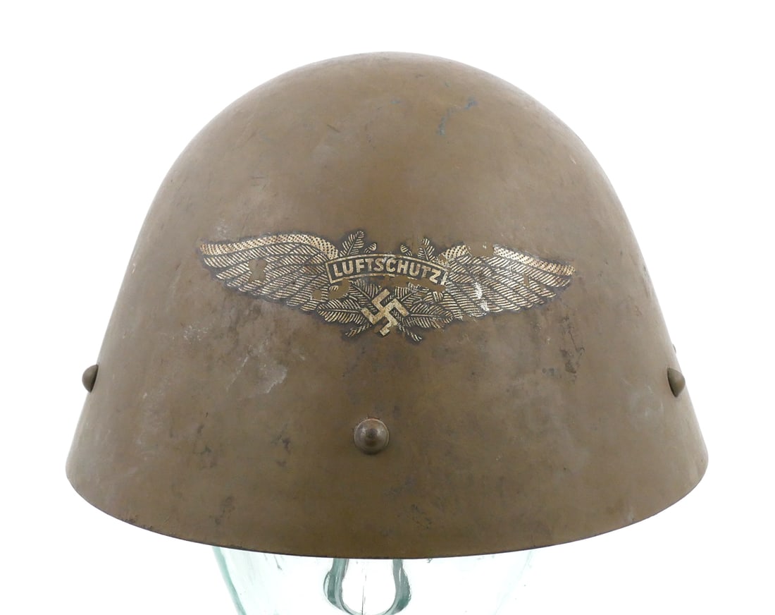 WWII Czech M32 Luftschutz Reissue Helmet: Czechoslovakian Model 1932 / Vz32 steel helmet reissued by the German Luftschutz during World War II. The "Egg Shell" features include six prominent side lugs (three per side) typical of Czech manufac