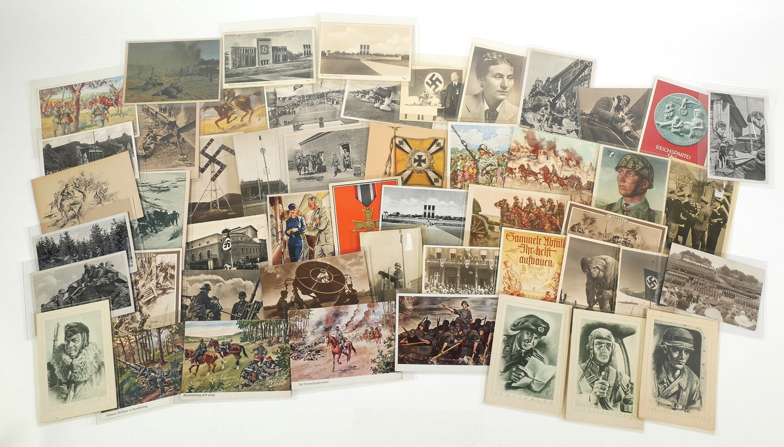 WWII: (50) German Postcard Collection: World War 2 Nazi related postcards, group of 50. Various types of cards including real photo postcards RPPC and art reproductions. All Nazi related. Images include - 1939 Reichsparteitag commemorative