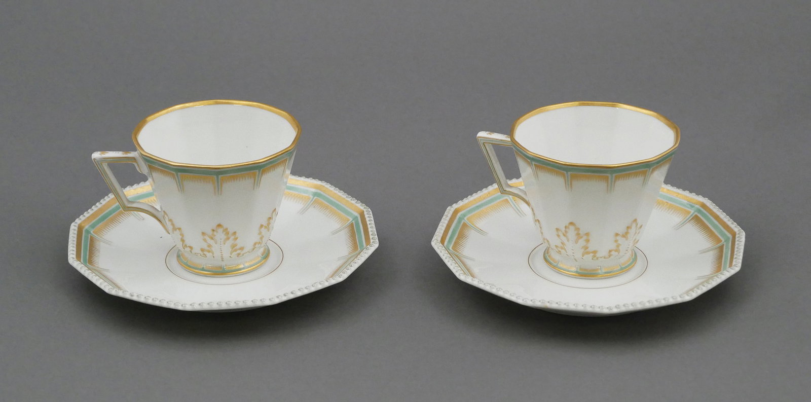 WW2: NSDAP Marked Nymphenburg Cups/Saucers: Two cup and saucer sets by Nymphenburg, with applied eagle and swastika emblem of the Nazi party, possibly hospitality pieces used in an upscale hotel that catered to Third Reich officials. This item 