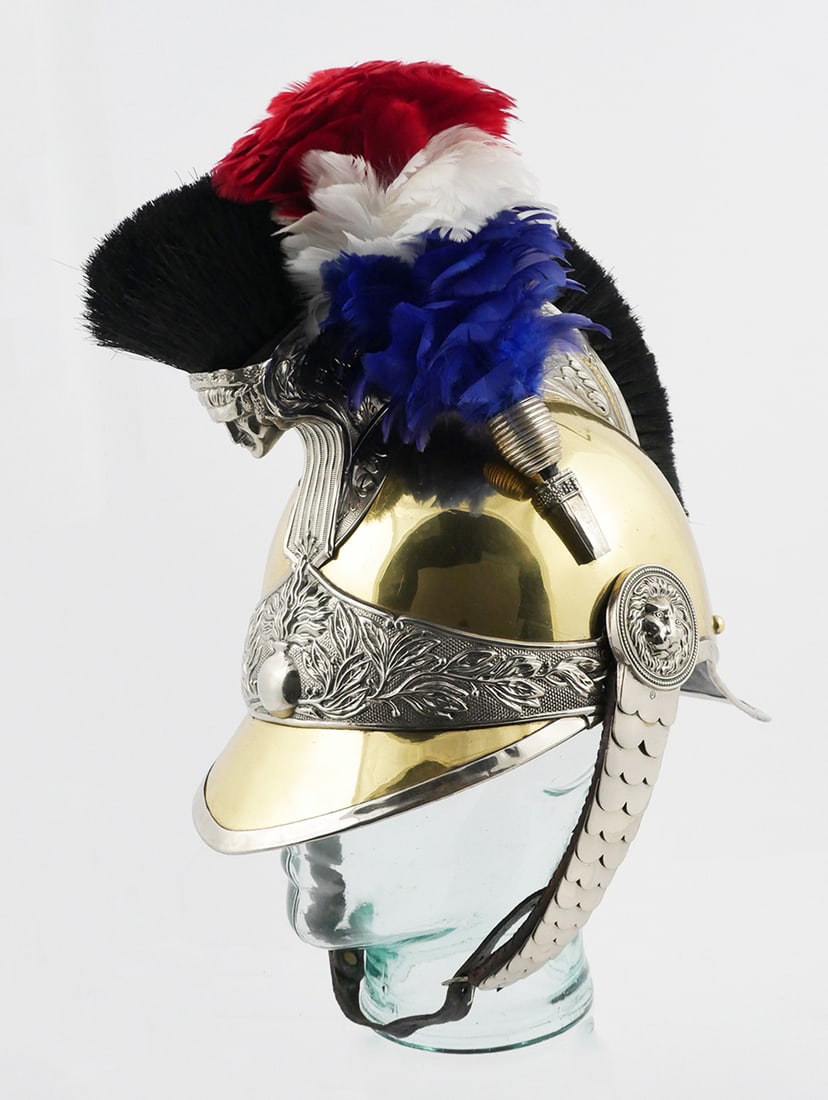 Pre WWI French Gendarmerie Helmet: French helmet of an equestrian gendarme, presumed to be19th c. 1912 model. Brass with embossed white metal, scaled white metal and leather chin strap, crest with horsehair, feather plume. Marked "Fran