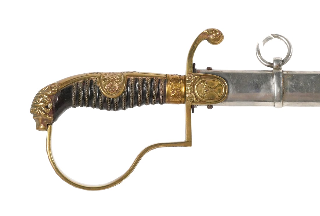 German Lion Head Officer's Dress Saber ACS: Circa 1910-1935 Officer's dress saber featuring a 32" etched blade, approx. 13/16" wide at the ricasso, with floral and martial motifs including crossed swords. Ricasso bears the scales logo of Alexan