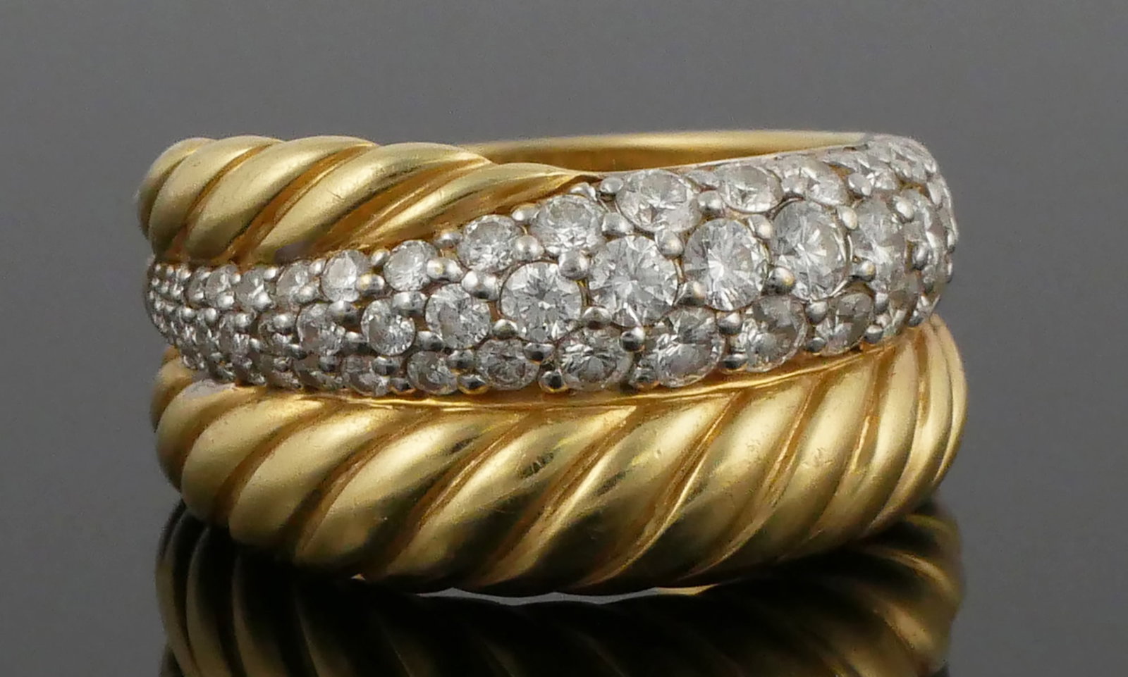 DAVID YURMAN 18K Gold Diamond Ring: Yurman 18 karat yellow gold crossover cable style ring. 12.43 grams tw, size 6-1/2 - 6-3/4. This item can be shipped in-house.