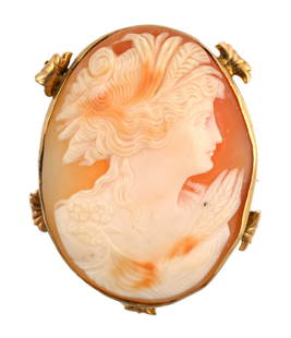 Vintage 10K Gold Shell Cameo Brooch: Antique hand-carved shell cameo brooch set in a decorative 10K gold frame. The cameo depicts a classical lady in profile, possibly depicting Demeter, the goddess of agriculture, harvest, and fertility