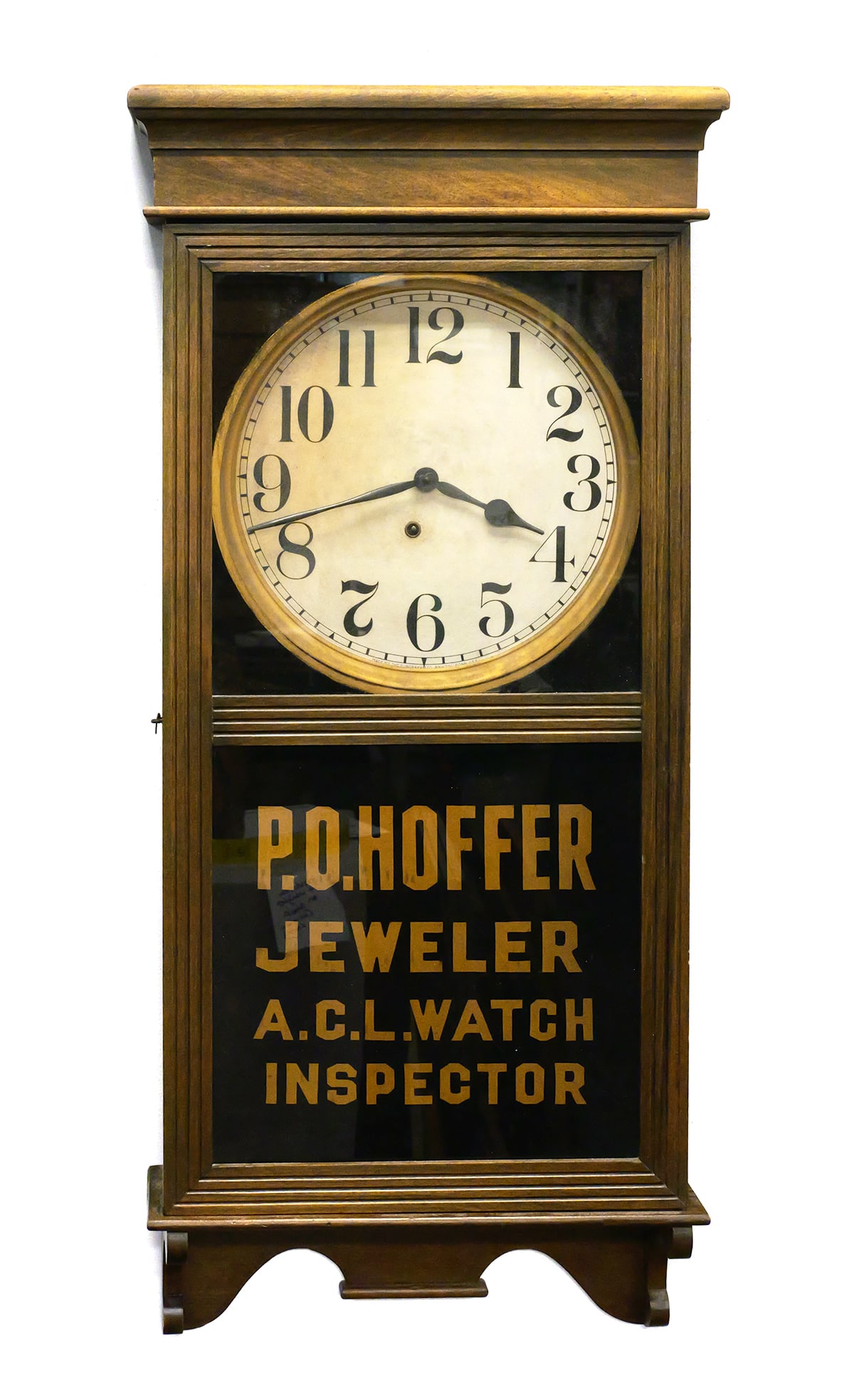 1940s NC Jeweler's Advertising Wall Clock: Antique wall clock with reverse painted panel advertising "P.O. Hoffer, Jeweler, A.C.L. Watch Inspector." Believed to be from the early 1940s. Hoffer ran a jewelry store in Fayetteville, N.C., from at
