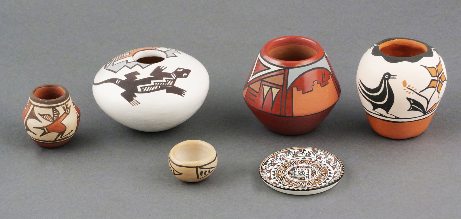 (6) Pueblo Pottery Pieces, All Signed: Six Pueblo pieces, signed Elizabeth Medina (Zia), Stella Teller (Isleta), Joe & Thelma Talachy (Pojoaque), Hilda Tenorio (Santo Domingo), RN (unknown). The miniature plate is illegibly signed. Tallest