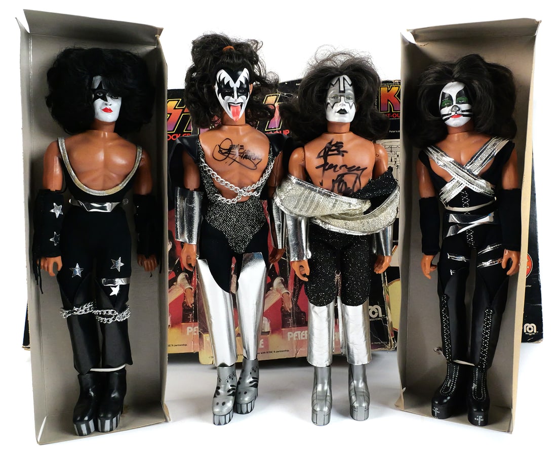 KISS Rock Band Action Figures 1978, 2 Signed: KISS "America's #1 Rock Group" 1978 Mego 12" action figures in original boxes. Includes all four band members. Two of the figures have been signed by the musicians: Gene Simmons and Ace Frehley. Autog