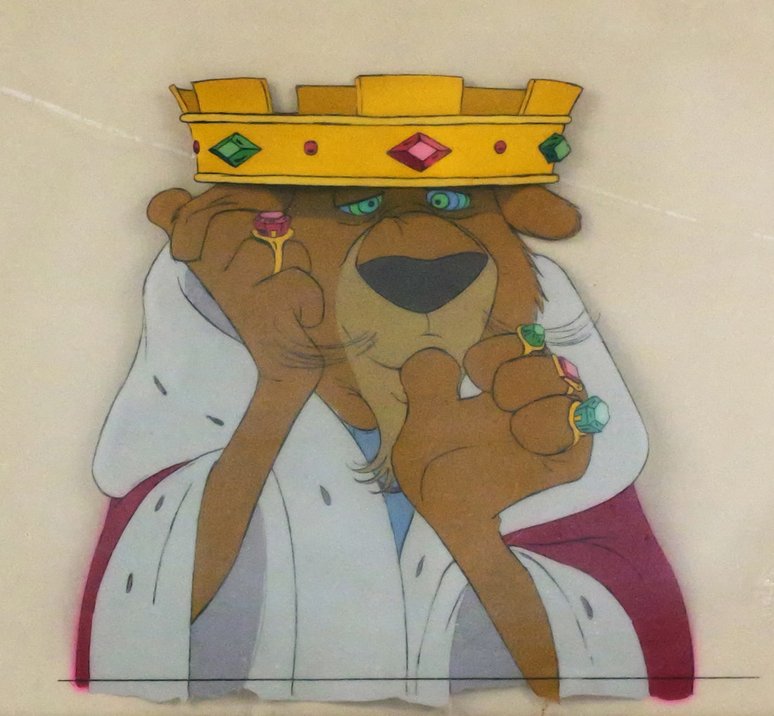 Walt Disney Production Cel from Robin Hood: Original hand-painted production cel on acetate, used in Walt Disney Productions' Robin Hood (1973). The cel features Prince John, the usurping lion king, shown draped in royal robes and crown, with m