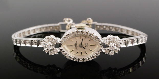 14K Gold Diamond Jules Jurgensen Watch: 14 karat white gold watch set with diamonds around the face and the entire band. 14 karat white gold, 17.7 grams tw, diamonds range from .01 to .07 carats. Vintage, Art Deco or Art Moderne style.