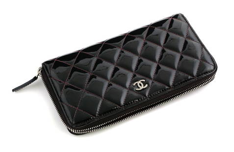 CHANEL Patent Zip Around Wallet COA: Chanel black patent quilted leather, zip around wallet with pink stitching and interior, silver tone interlocking "C" logo. With certificate of authenticity. 7-3/4": x 4-1/2". This item can be