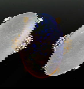 14K Gold Diamond Opal Ring: 14 karat yellow gold ring set with an opal and diamonds. Classic design, central crystal opal cabochon accented on each side by 5 diamonds, each approx. .03 carats. 14 k gold, 6.65 grams tw. Opal