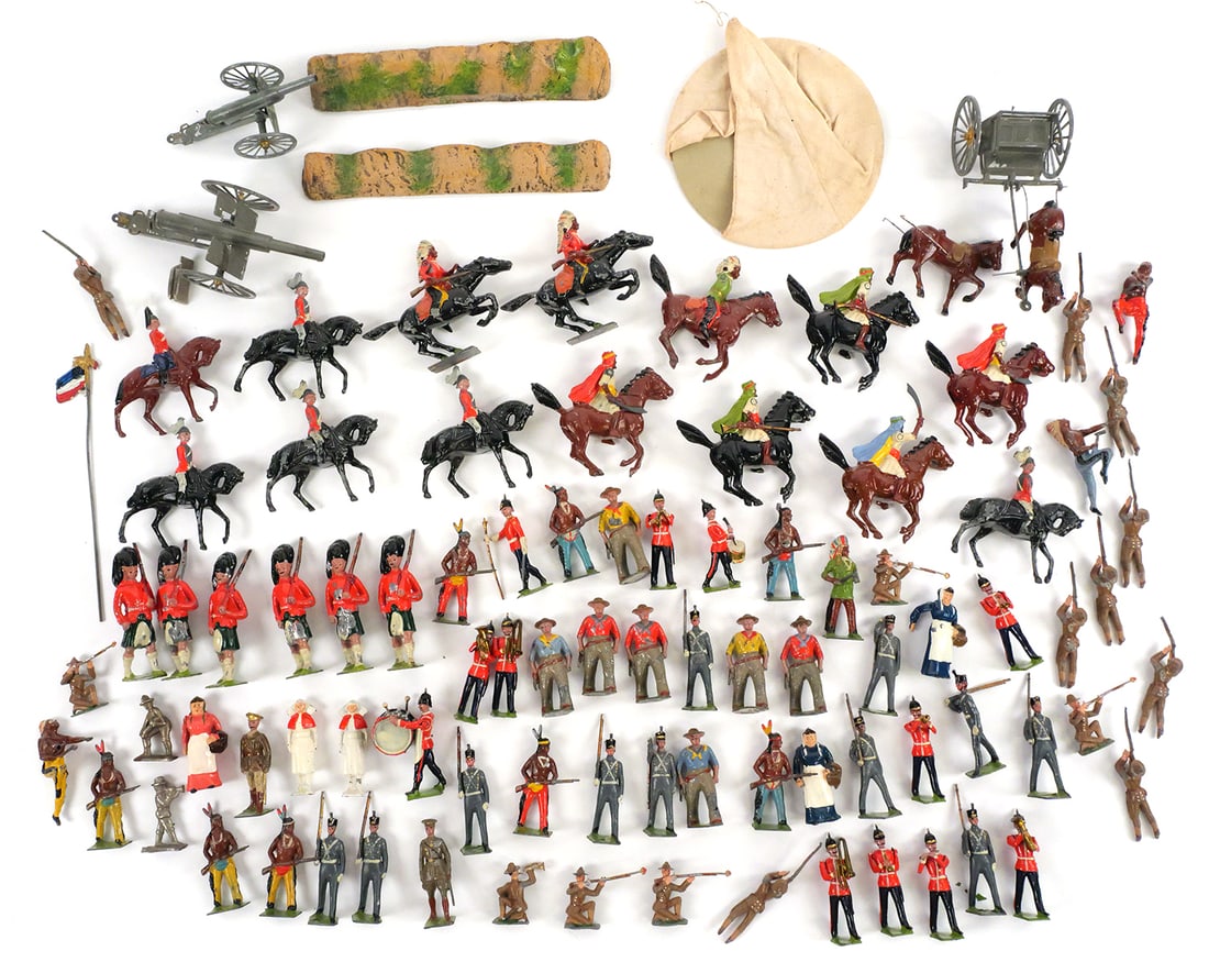 Lot of Britains Ltd Lead Figures & Accessories: Extensive mixed group of vintage Britains Ltd and similar lead figures, including British infantry, cavalry, U.S. WWI soldiers, cowboys, and Native American warriors, along with horses, cannons, and w