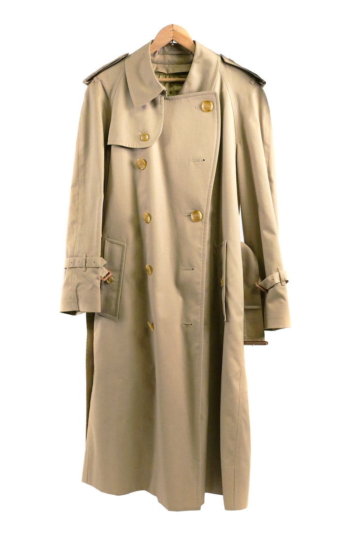 Burberry Trench Coat, Size 36 Never Worn: Tan canvas double breasted trench coat with zip out interior wool lining in their iconic plaid, coat is lined with cotton/polyester blend in the same plaid. Original belt, and Burberry storage bag. Si