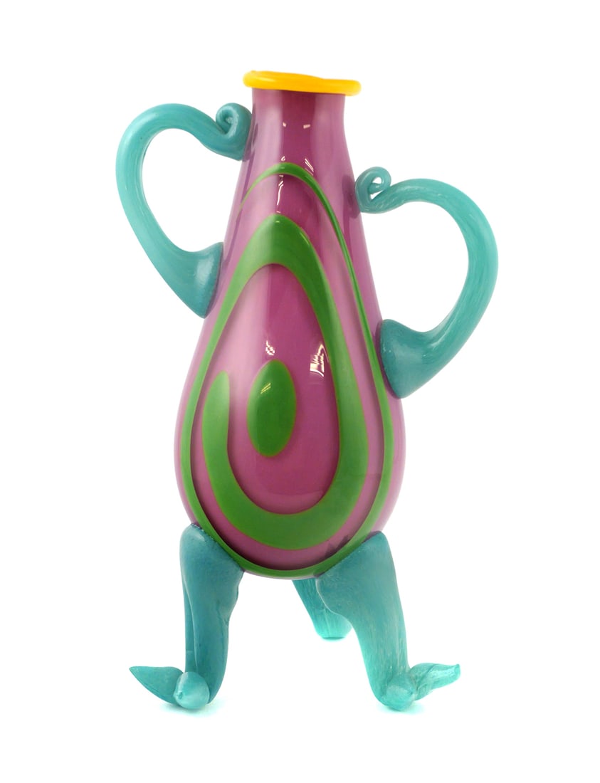 Contemporary Art Glass Sculpture: Colorful blown glass sculpture with whimsical form, featuring purple body with bright green swirl design, uneven turquoise handles and tripod legs with feet, and yellow rim. Signed on underside. Art g