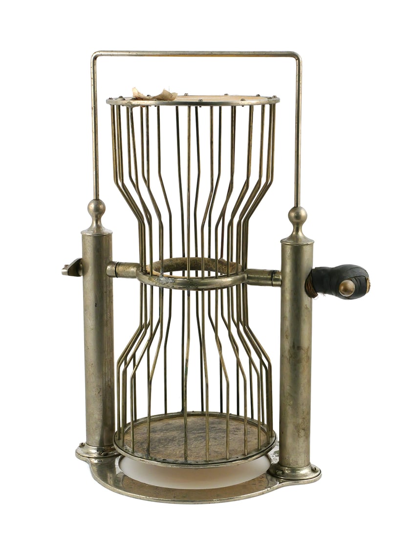 H.C. Evans Birdcage Chuck-a-Luck Dice Game: Hourglass wire dice cage on a metal base with twin uprights and circular top and bottom plates, used for the three-dice gambling game known as Chuck-a-Luck. Stamped "H.C. Evans & Co. Chicago" on the b