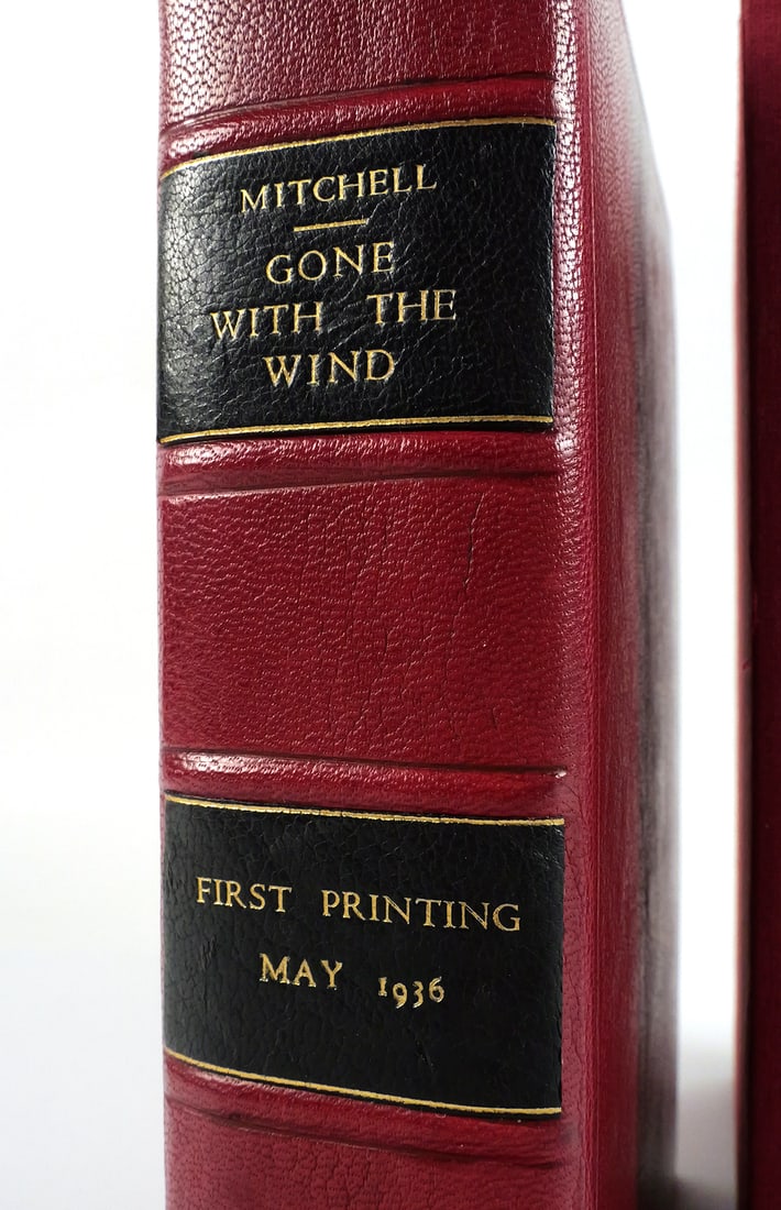 GONE WITH THE WIND, 1st Printing SIGNED: Rare, May 1936 true first edition and first printing of Gone with the Wind, signed on the front free endpaper by author Margaret Mitchell. Professionally rebound in red leather. Numbered to 1,037