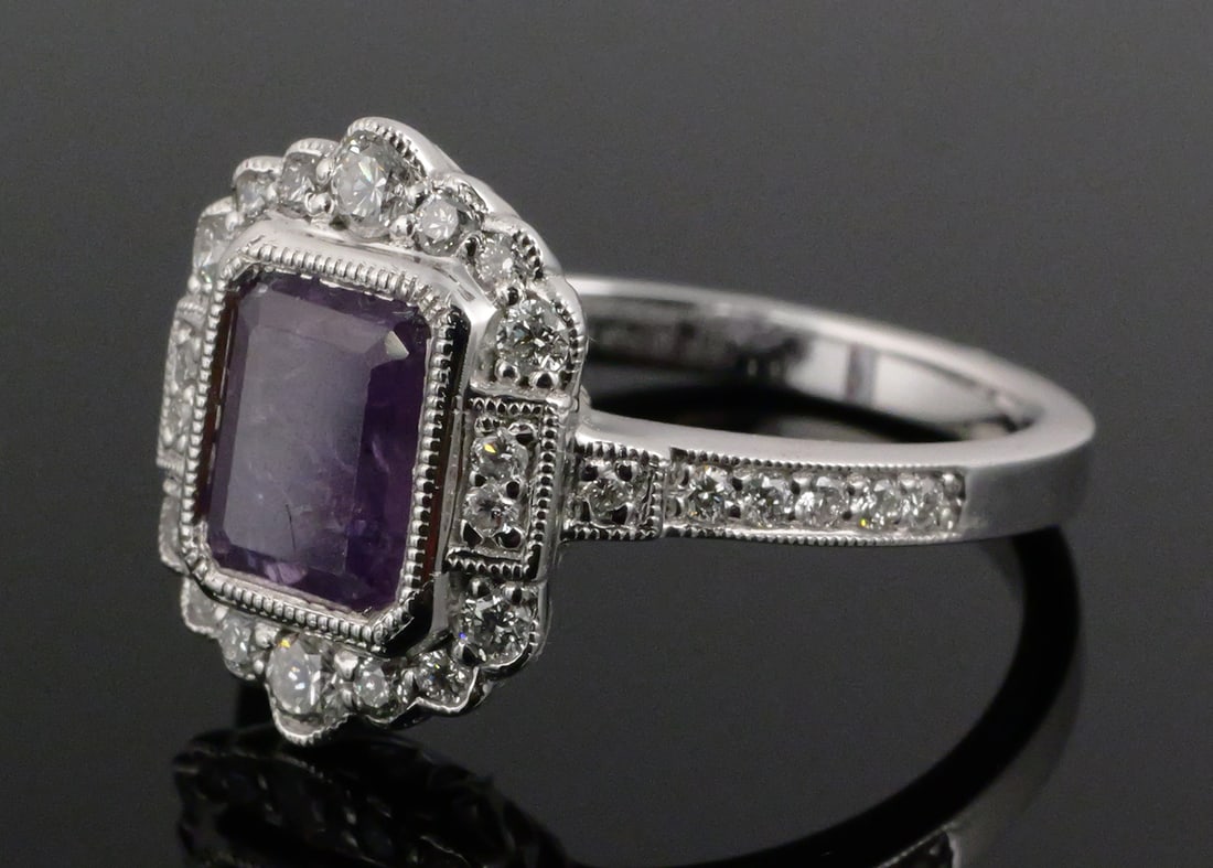 Platinum Kashmir Sapphire Diamond Ring: Platinum ring set with an octagonal step-cut Kashmir sapphire corundum weighing 2.87 carats, pinkish purple color, transparent, no indications of heating per GIA Sapphire Origin Report. Accented by