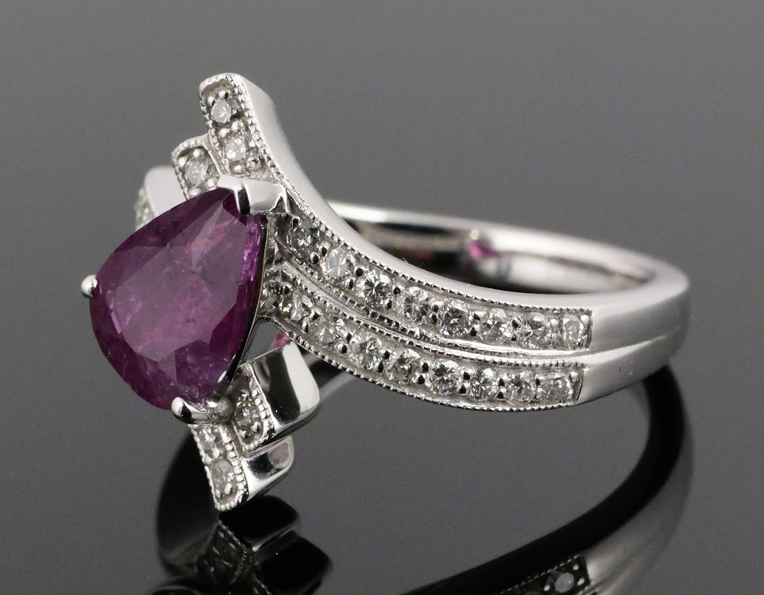 Kashmir Sapphire Diamond Platinum Ring: Platinum ring set with one natural sapphire and round diamonds. Center stone is a pear-shaped purplish pink natural sapphire weighing 2.08 carats, measuring 9.05 x 6.67 x 4.81 mm. GIA Sapphire Origin