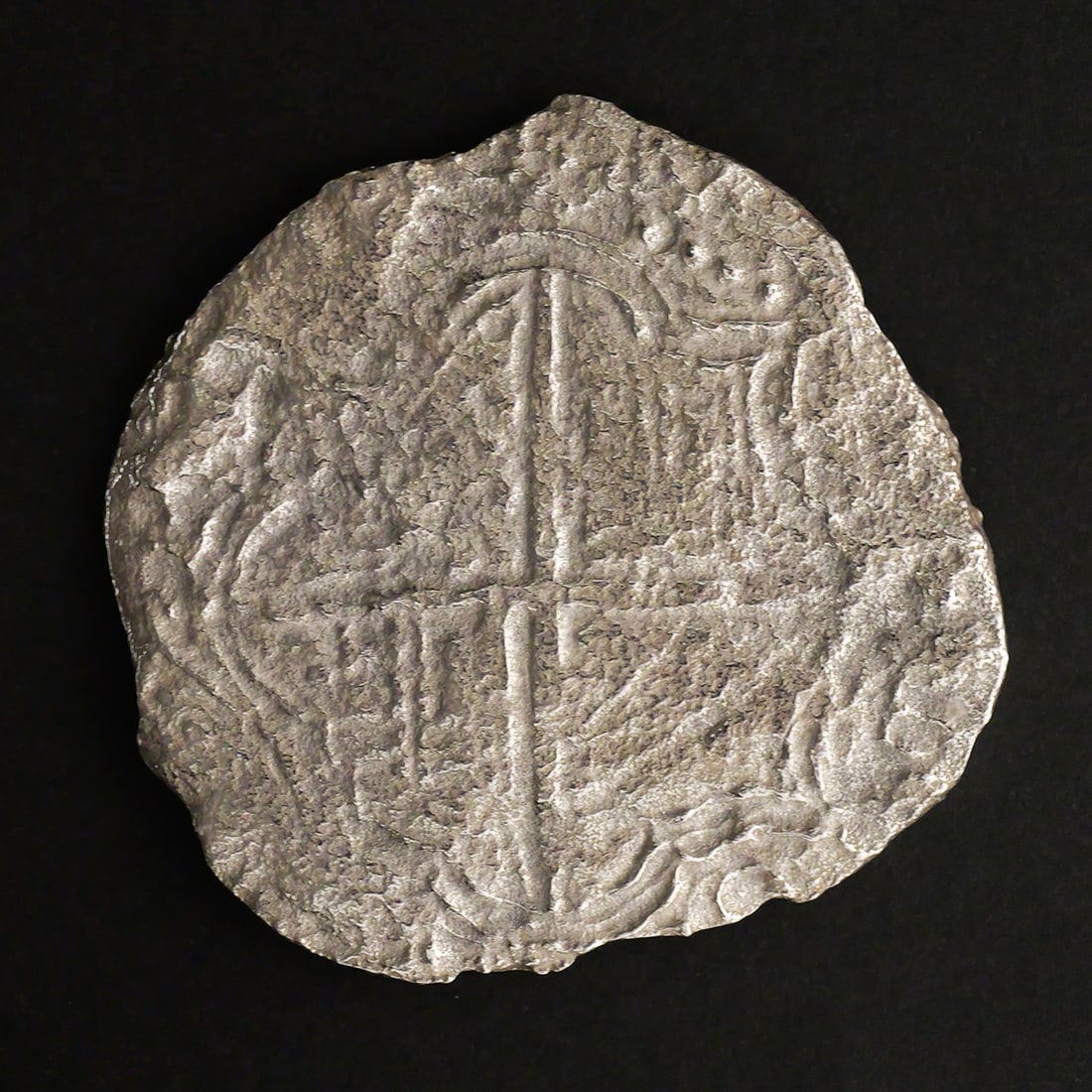 ATOCHA 8 Reales Grade 3 Silver Cob: Spanish colonial silver cob coin recovered from the Nuestra Senora de Atocha shipwreck. Denomination: 8 reales. Mint: Potosi. Reign of Philip III. Weight 16.5 grams. Grade THREE (3). Reverse is