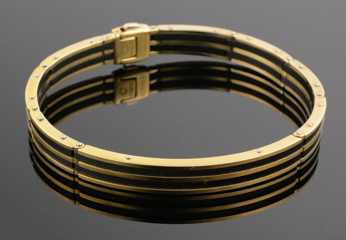 Chimento 18k Gold Bracelet, Vintage: Italian 750 yellow gold bracelet with striking black spacers. Double-signed Chimento. Diamond mounted on clasp. Fits 8" wrist. Total weight 38.6 grams. PLEASE NOTE: Credit cards will not be accepted
