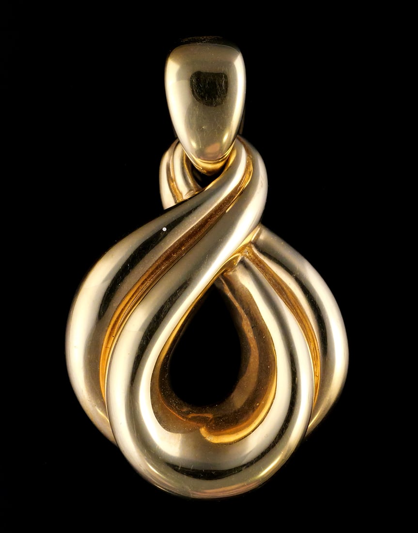 14K Gold Infinity Twist Pendant: 14 karat yellow gold pendant, modern infinity loop design. Signed by an unknown maker. 14 k yg, 2.8 grams tw. Approx. 1" wide, 1-1/2" long. This item can be shipped in-house. Multiple lot combined