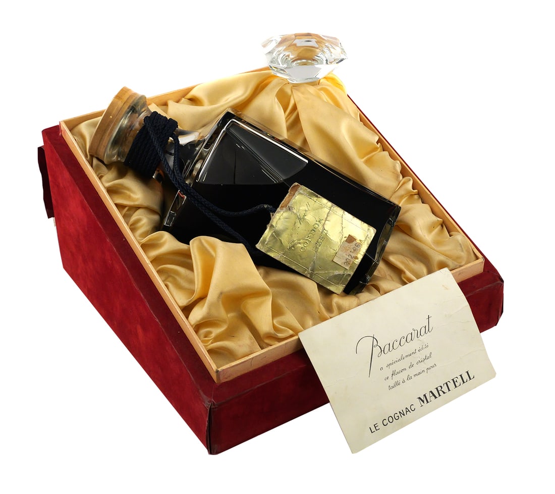 Baccarat Martell Cordon Bleu Cognac: Sealed bottle of Martell Cordon Bleu Cognac in a Baccarat Crystal Decanter with stopper. Presented in the original red velvet presentation box. PLEASE NOTE: This is a collectible bottle, and while it