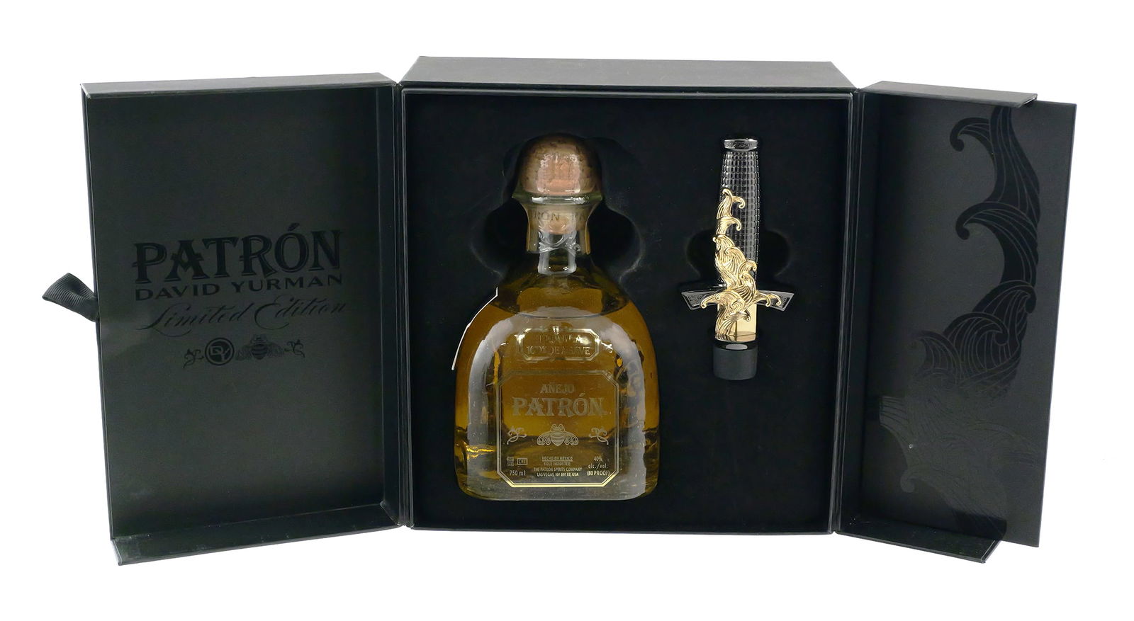 Patron Anejo David Yurman Set: Designer collaboration limited edition dagger bottle stopper set. Designed by Evan Yurman, director for David Yurman men's and timepiece collections, for Patron Anejo. Boxed set with a gunmetal and 24