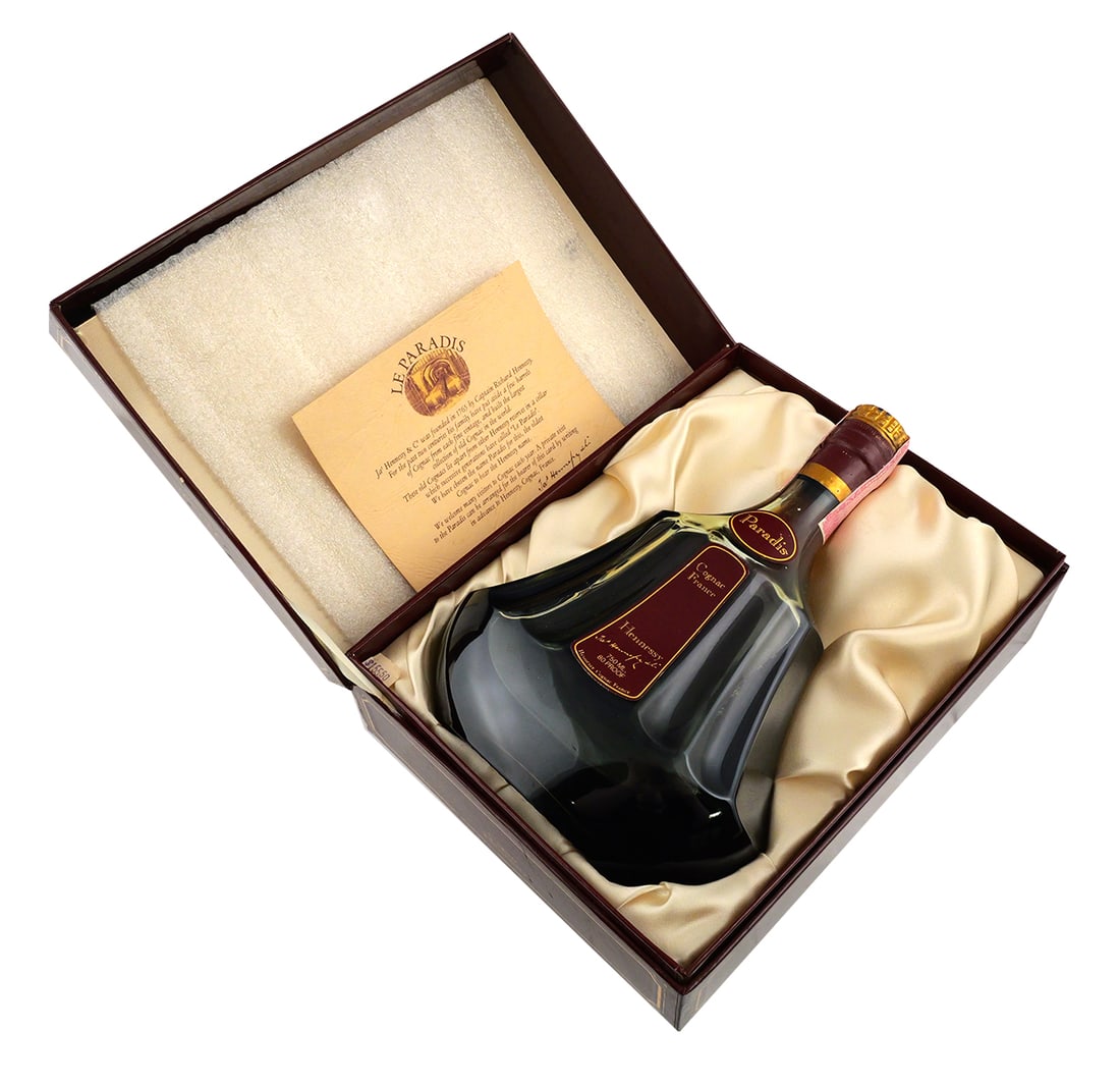 Hennessy Paradis Cognac Bottle: Sealed bottle of Hennessy Paradis cognac, 750 ml, 80 proof. Glass bottle embossed Hennessy Cognac France and Ets E Hennessy Cognac France. Paper label marked Paradis, Cognac France, Hennessy, Jas Henn