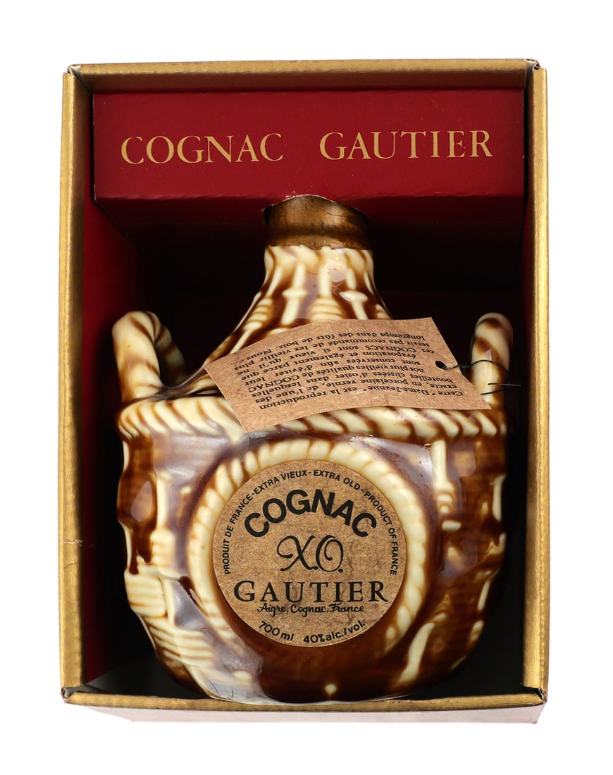 Cognac Gautier XO Ceramic Bottle: Sealed ceramic bottle of Cognac Gautier XO labeled Extra Vieille, 700 ml. Bottle housed in the original red and gold presentation box marked Cognac Gautier XO. Hang tag present. PLEASE NOTE: This is a