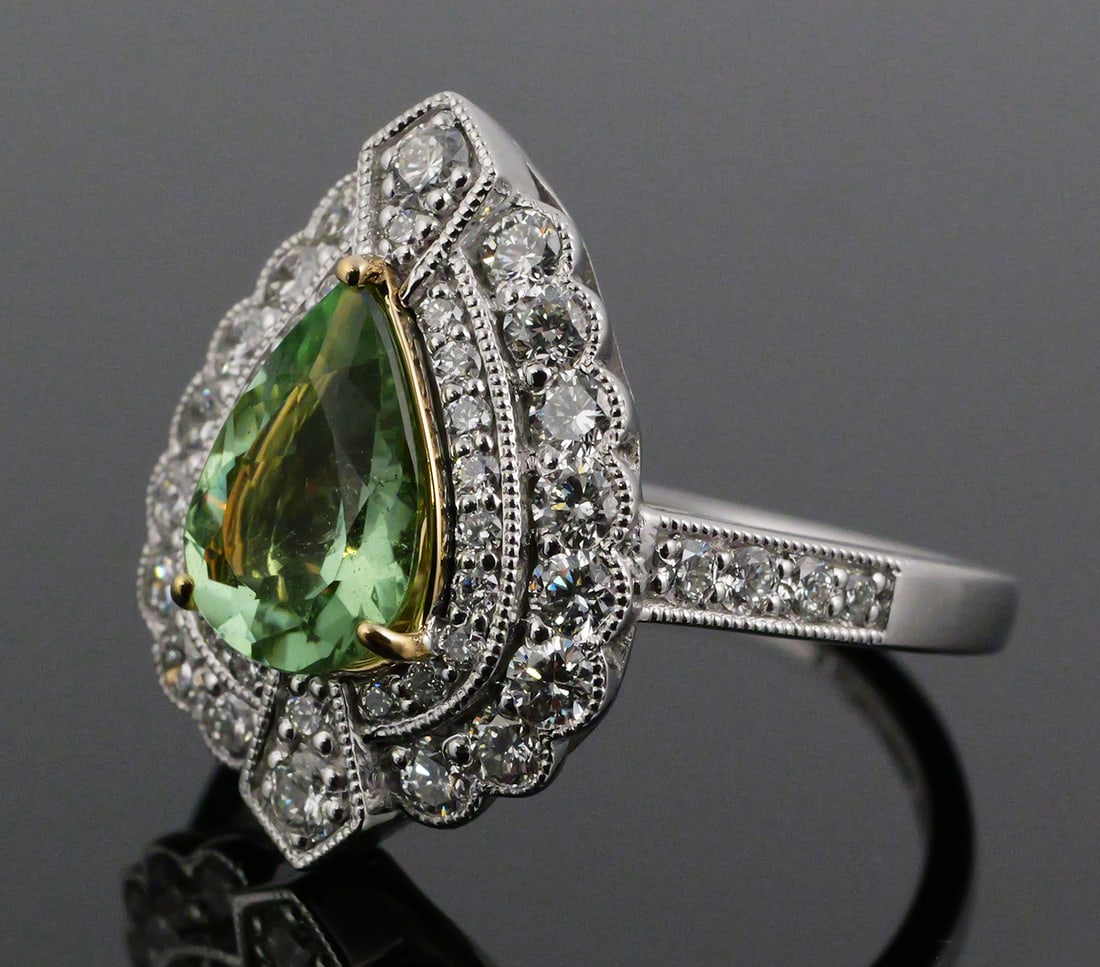 Platinum 18K Tourmaline & Diamond Ring: Platinum and 18K yellow gold ring marked Gady Shemesh Los Angeles. Set with one GIA-certified natural Paraiba tourmaline, pear shape, modified brilliant cut, 1.45 carats, measuring 9.61 x 6.89 x 3.96