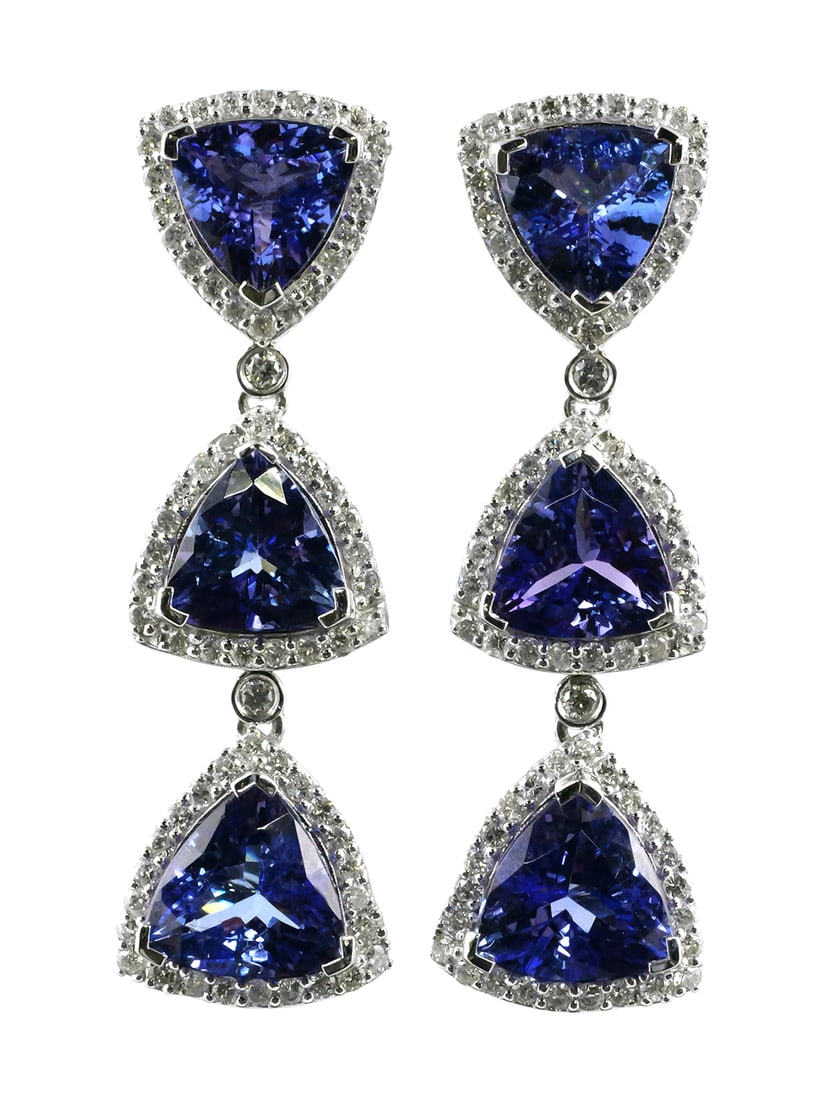 Platinum Tanzanite & Diamond Earrings: Platinum earrings set with six triangular brilliant faceted natural tanzanite zoisite gemstones totaling 14.79 carats. Tanzanite dimensions stated as 9.5-8.0 mm. Color bluish violet, transparency